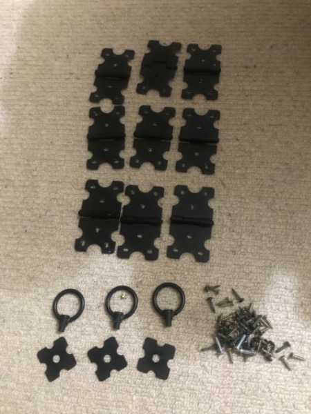 Thumbnail for Black metal hinges and door pulls