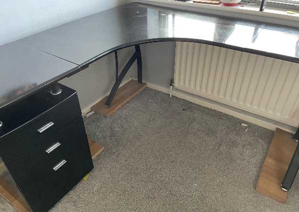 Large black corner desk with drawers