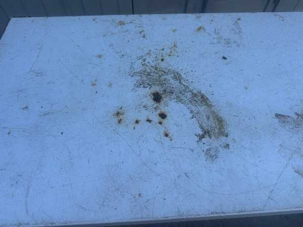 White metal desk on wheels