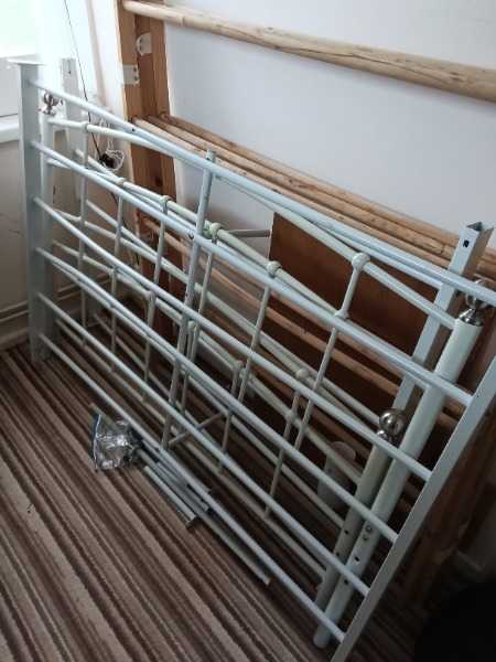 Metal framed double bed with mattess