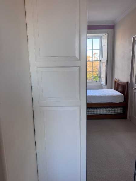 Four IKEA PAX wardrobe doors (230cm height) – two white panelled and two mirrored