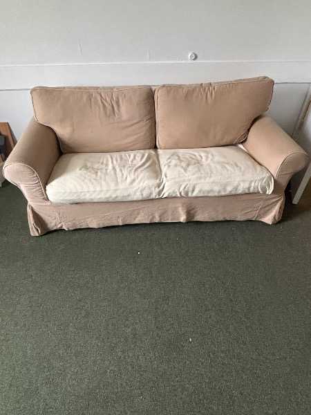 Beige Bed settee.
