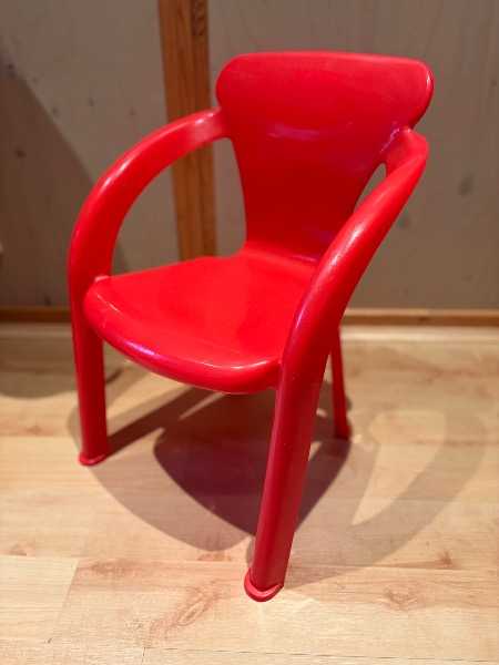 Children’s red plastic chair