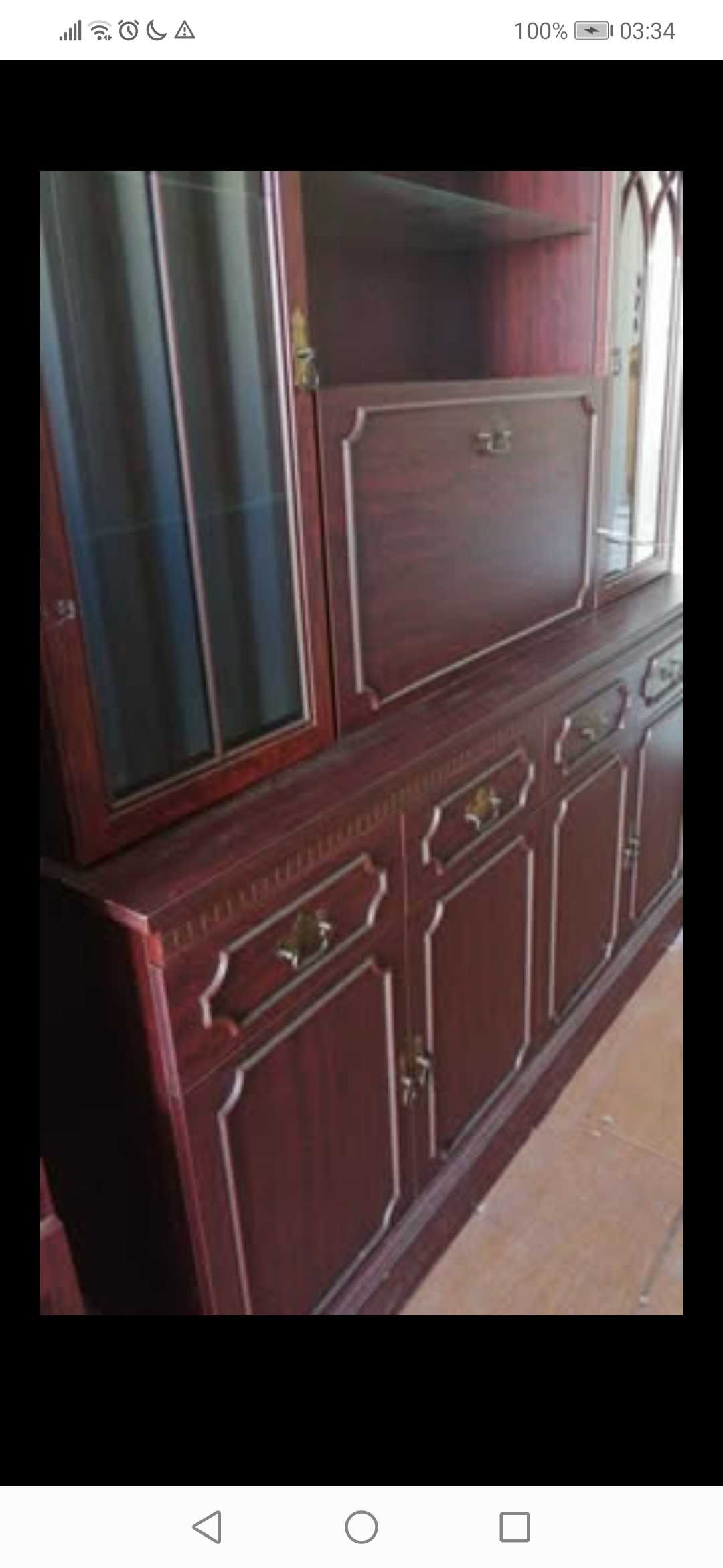 Red coloured wood sideboard and wall unit