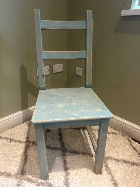 Distressed blue wooden chair