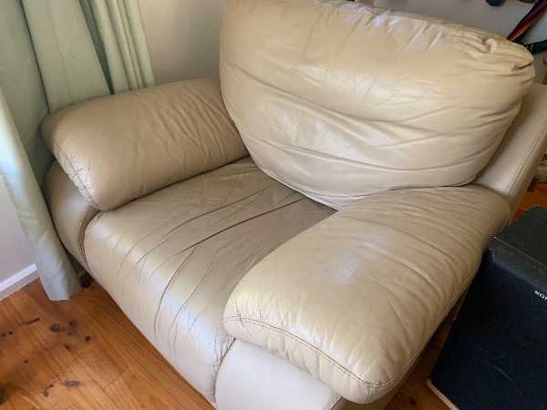 Leather 3-Seater Sofa and 2 Arm Chairs with ottoman on castors.