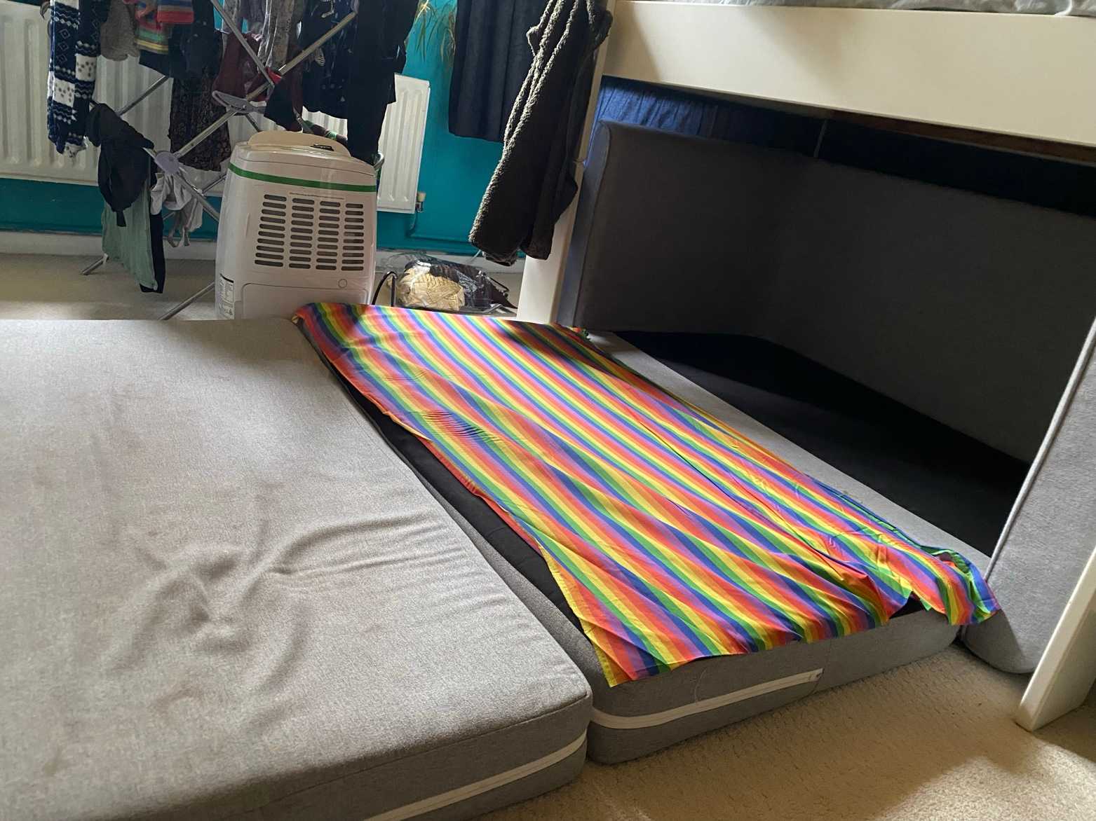 Small light grey sofa bed