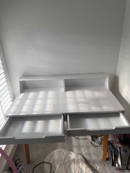 White desk with drawers and top shelf