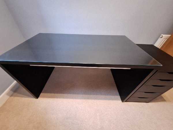Black office desk with glass work surface