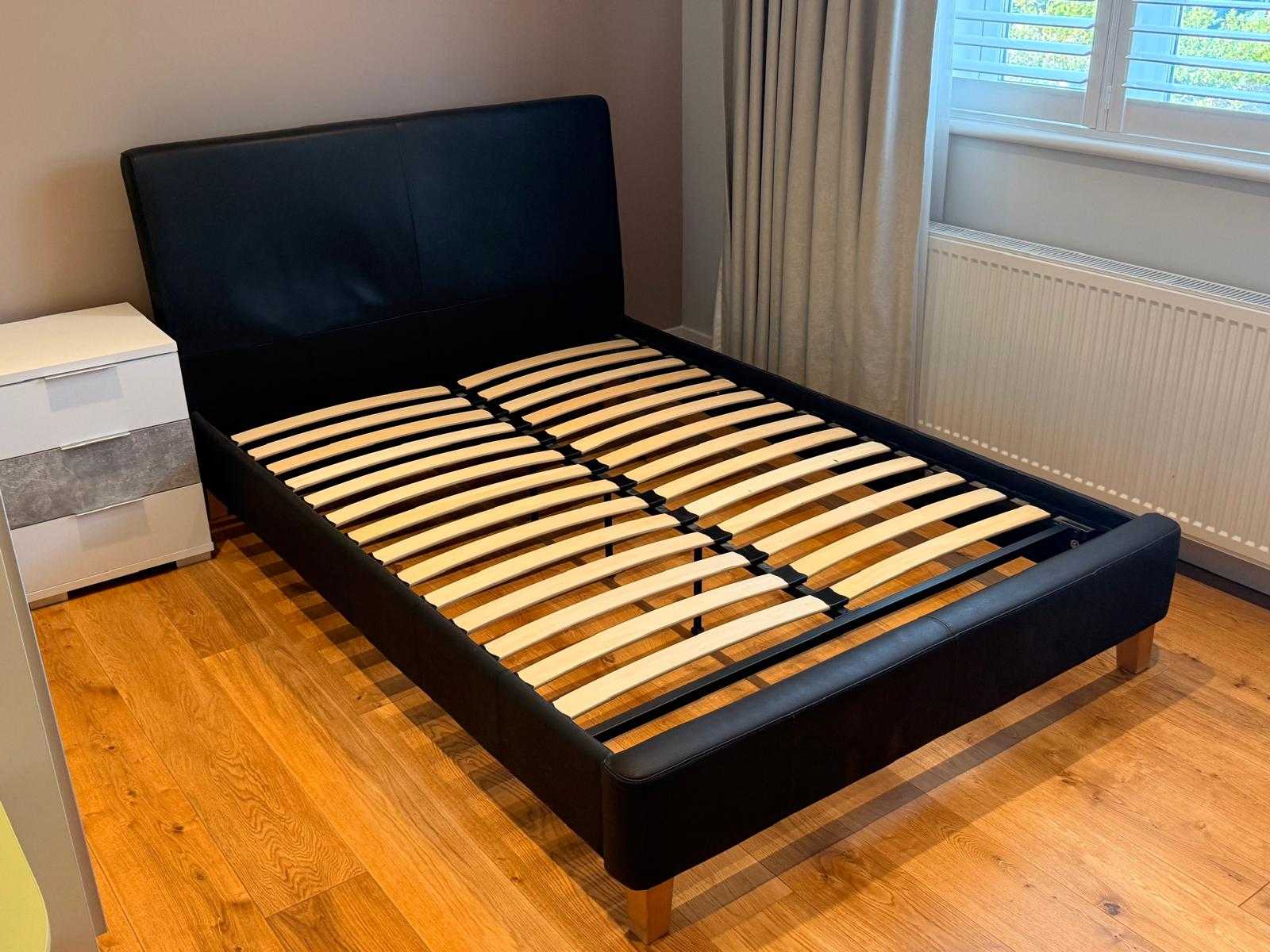 Bed frame with large headboard