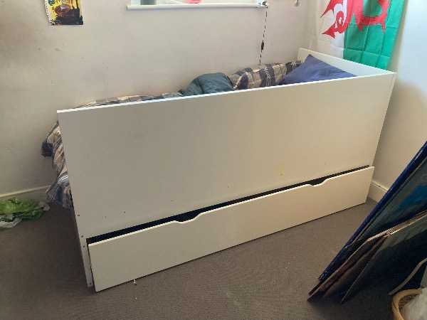 Single bed with trundle bed underneath