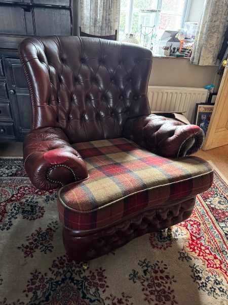 Well loved burgundy leather armchair