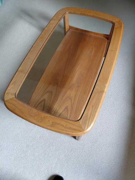 Glass topped coffee table