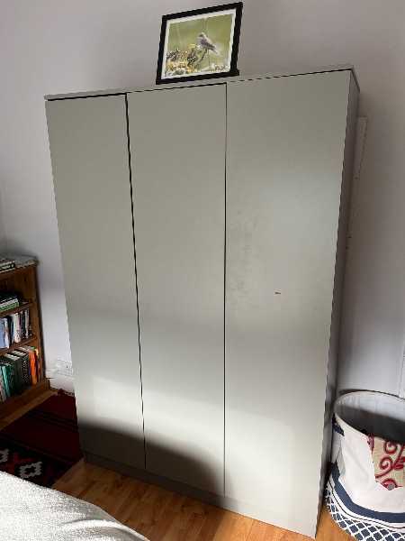 Wardrobe with rail and shelves