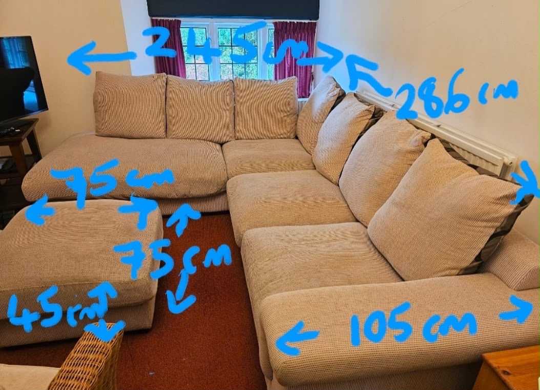 Large corner sofa with foot-stool and reversible cushions